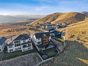 Aerial perspective of suburban area featuring a mountainous background