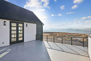 View of patio featuring french doors and a mountain view