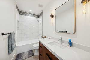 Upstairs bathroom with shower / bath combination, vanity, and recessed lighting