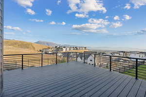 Large deck off primary bedroom with mountain and residential view