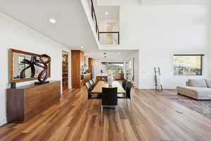 Dining area with recessed lighting and light wood-style floors