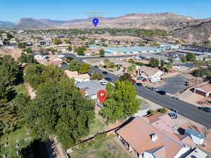 Aerial perspective of suburban area featuring a mountainous background