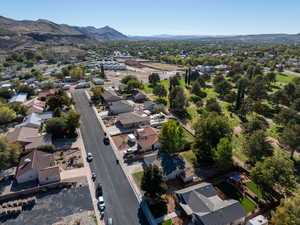 View of property location featuring nearby suburban area and a mountain backdrop