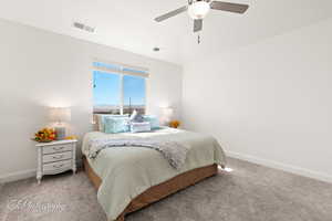 Carpeted bedroom with baseboards and ceiling fan