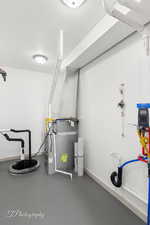 Utility room featuring drainage system