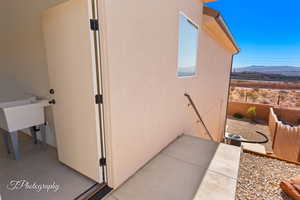 View of home's exterior featuring a mountain view and stucco siding