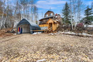 View of outbuilding with stairs