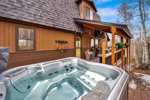 Wooden deck with a hot tub