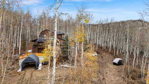 View of yard featuring a balcony