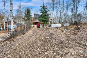 View of yard with a deck