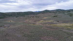View of mountain background featuring rural landscape