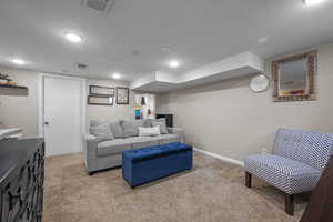 Living room with carpet floors and recessed lighting - or bedroom
