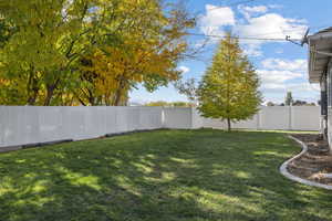 View of fenced backyard