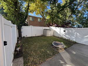 View of fenced backyard