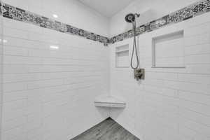 Full bathroom with tiled shower
