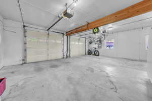 Garage featuring a garage door opener