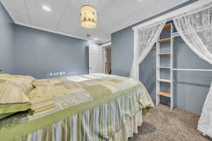 Bedroom with carpet flooring, recessed lighting, and a paneled ceiling