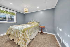 Bedroom with carpet flooring, a paneled ceiling, and recessed lighting
