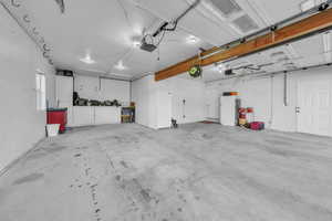 Garage with freestanding refrigerator