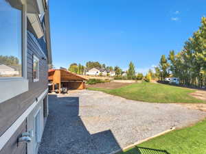 View of grassy yard featuring a residential view