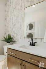 Bathroom with vanity and toilet