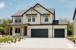 Modern farmhouse with covered porch, concrete driveway, an attached garage, and stucco siding