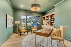 Living area with wood finished floors, recessed lighting, and a mountain view