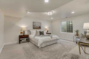Carpeted bedroom with baseboards and recessed lighting