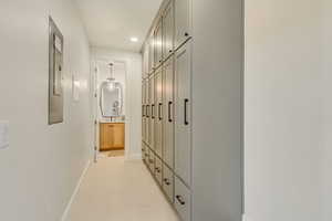 Hallway featuring baseboards and recessed lighting