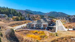 Rear view of property with a residential view and a mountain view