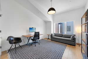 Office space featuring light wood finished floors and baseboards