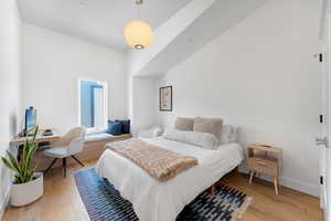 Bedroom featuring light wood-type flooring and a desk