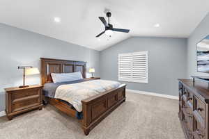 Bedroom with light carpet, vaulted ceiling, a ceiling fan, and recessed lighting