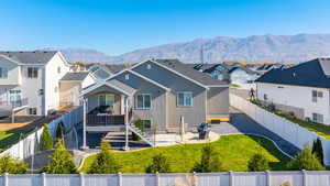 Back of property featuring a patio, a fenced backyard, and a residential view
