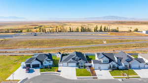 Aerial view of sparsely populated area featuring a mountainous background