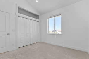 2nd main bedroom closet and mountain view. This room has recessed lighting, a ceiling fan, a loft, and is located off the dining area, opposte side of home from the primary bedroom