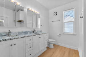 Primary bathroom with double vanity and shower