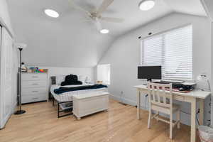 ADU bedroom with study space and 2 closets, one of which is full height, to the left