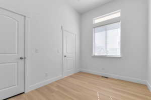 Study or front bedroom with high  ceiling and  transom window