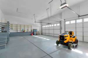 Generous sized 3 car garage fits an extended cab truck. Has EV plug