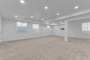 Basement family room looking west off the stair entry. Door to stairs is on the left in this picture