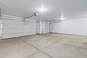 Garage featuring a garage door opener