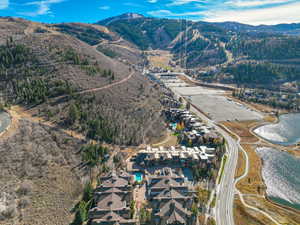 Aerial overview of property's location featuring a mountainous background