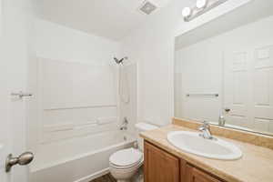 Bathroom featuring washtub / shower combination and vanity