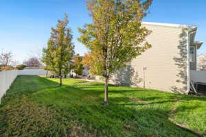 Fenced backyard featuring a patio
