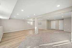 Basement featuring recessed lighting and light wood-style flooring
