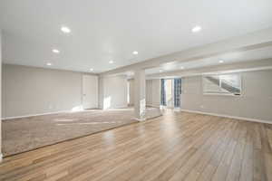 Basement featuring recessed lighting and light wood-style floors