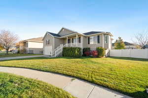 Single story home with covered porch, concrete driveway, and an attached garage