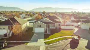 Aerial perspective of suburban area featuring a mountainous background