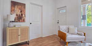 Living area featuring wood finished floors and baseboards